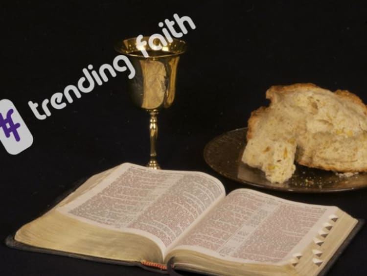 open bible and bread and a cup