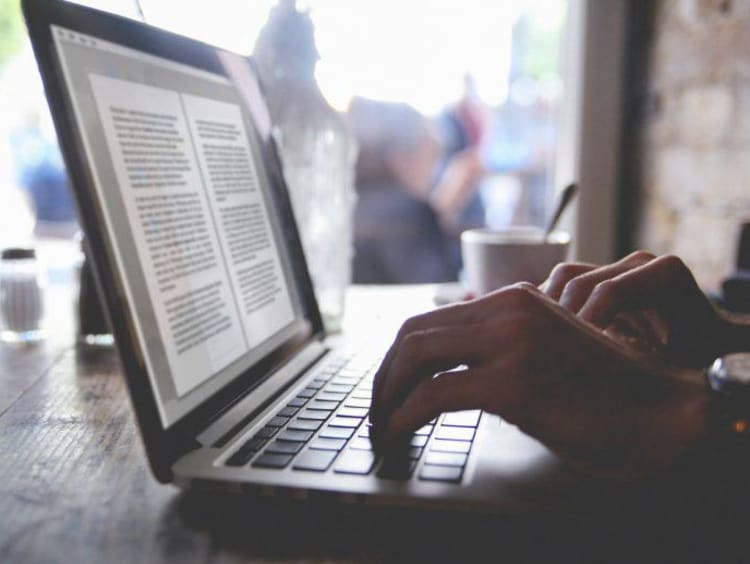 professional writer typing on a keyboard