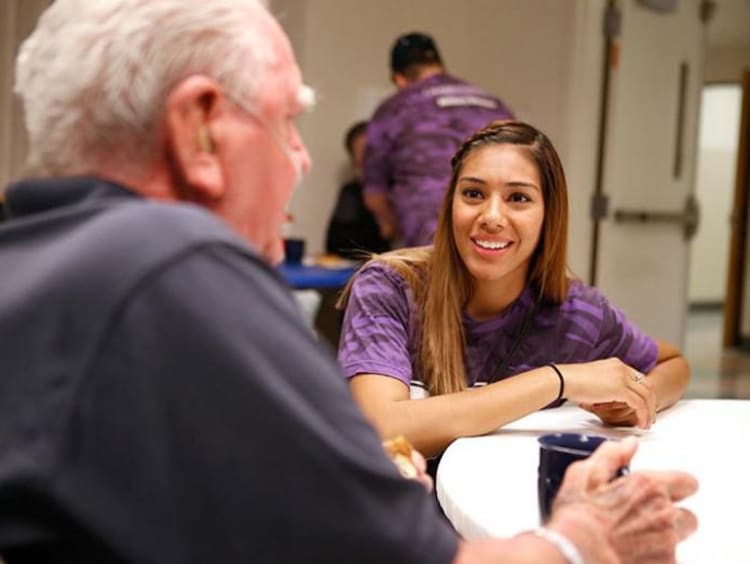 woman talking with an older man