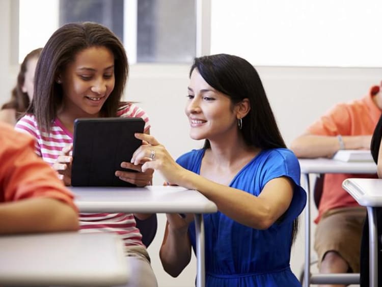 a teacher helping a student