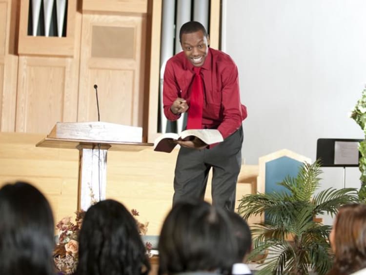 A pastor conducting a service at a church