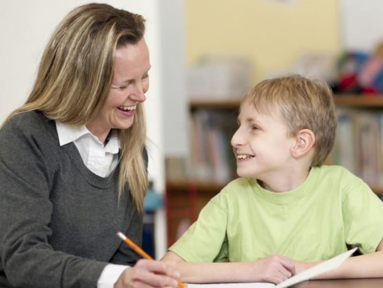 Woman teaching young student