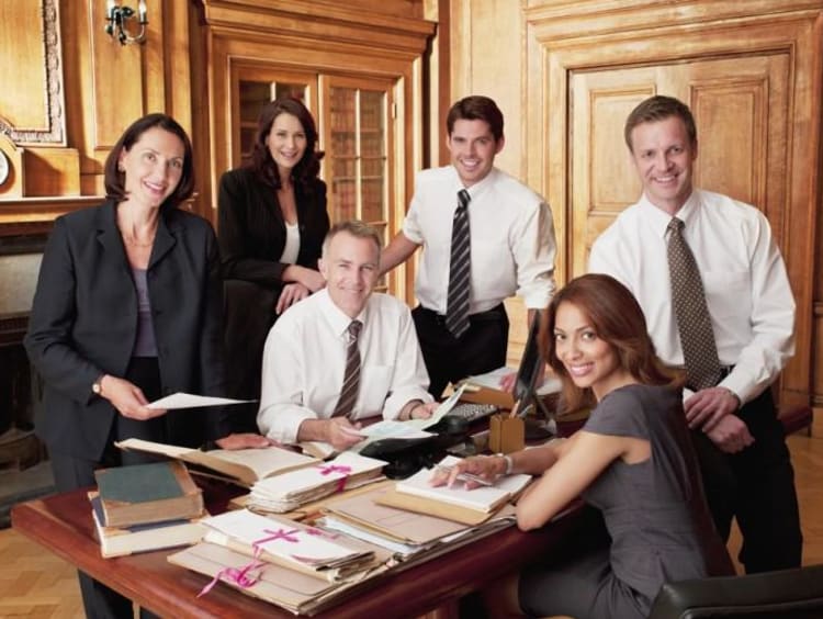 six lawyers looking over files