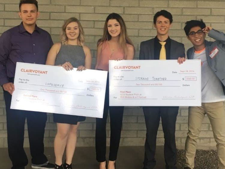 GCU honors students holding their prizes