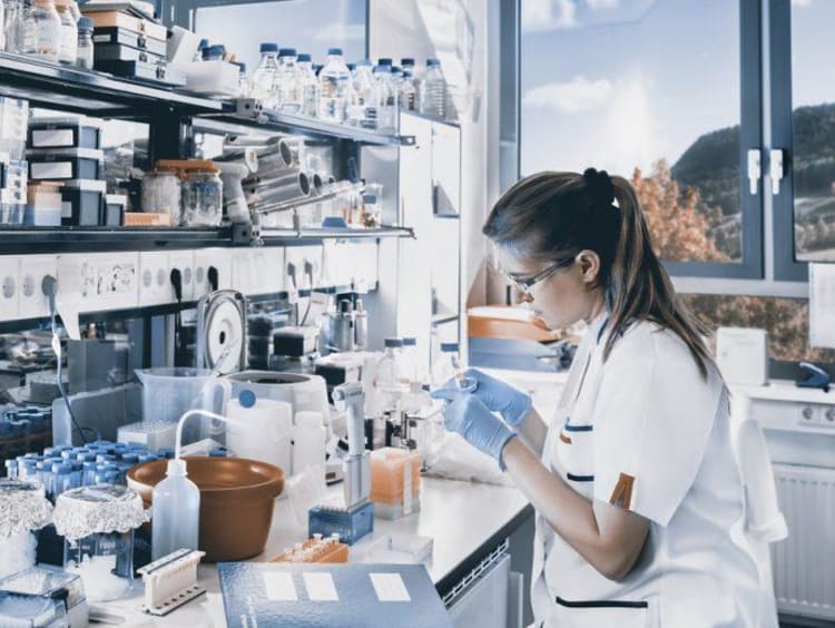 person working with chemicals in a lab