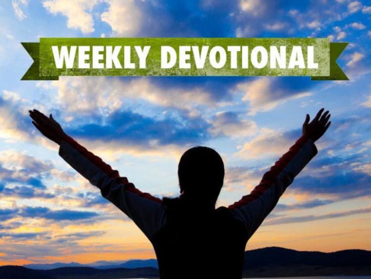 Weekly Devotional: Person with their hands up looking at the sunset