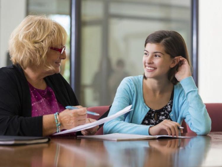 teacher and student smiling