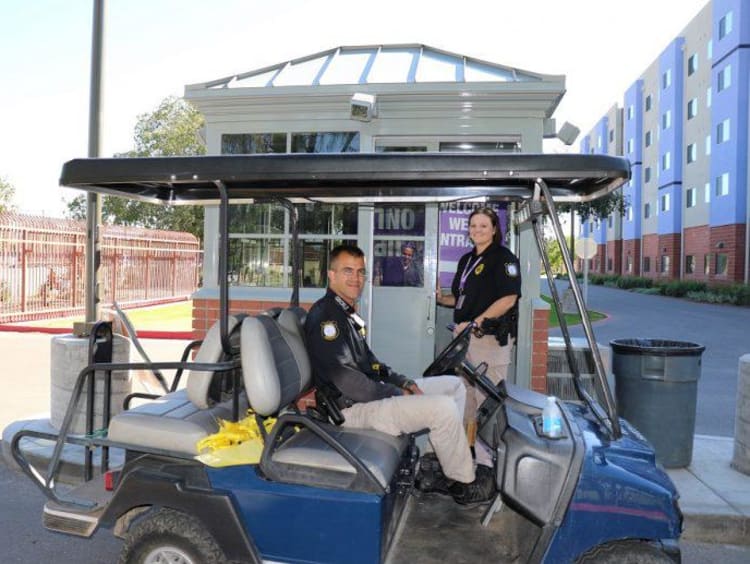 two public safety officers in a golf cart