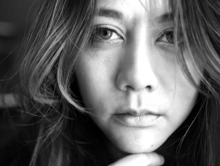 Close up in black and white of sad woman's face