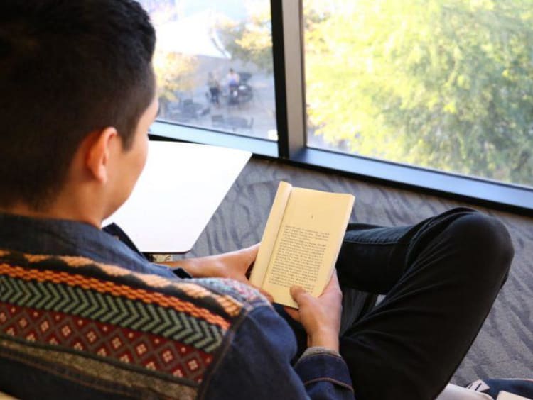 student reading a book