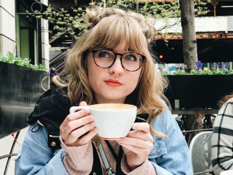 Jessalyn Johnson drinking a cup of coffee