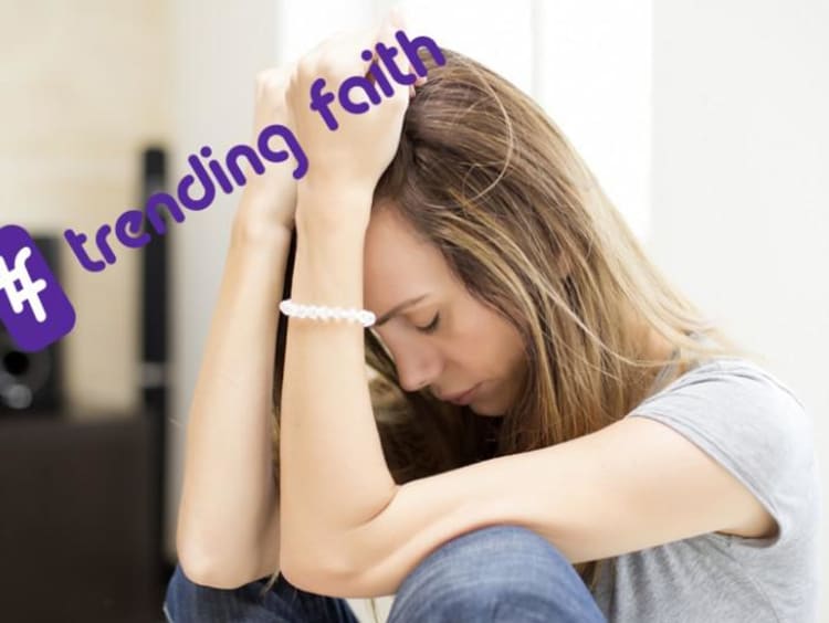 Student worrying under the Trending Faith logo