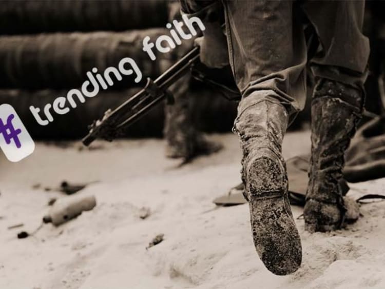 Hashtag trending faith text on top of close-up view of combat boots of two infantrymen