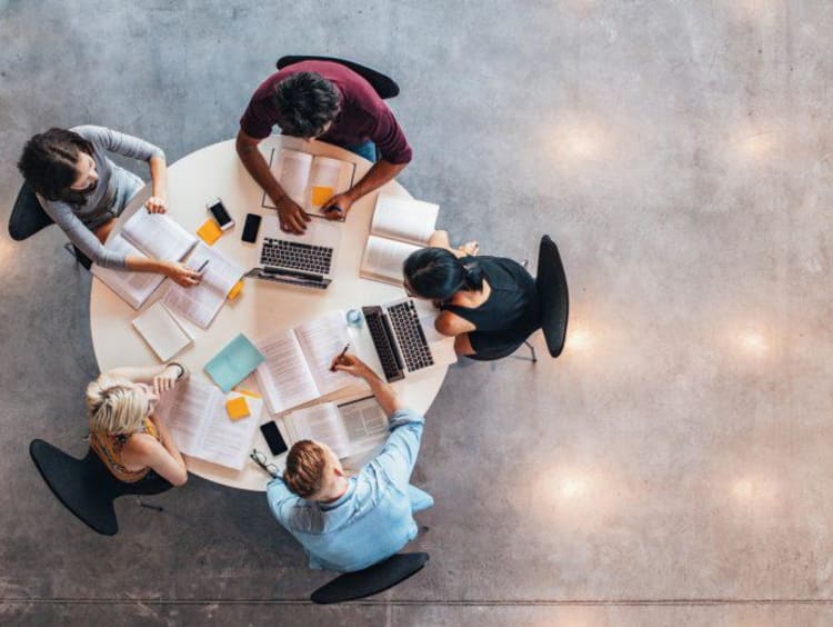 give people sitting around a table