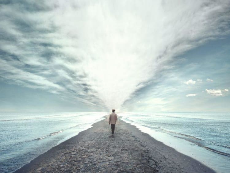 person walking on beach