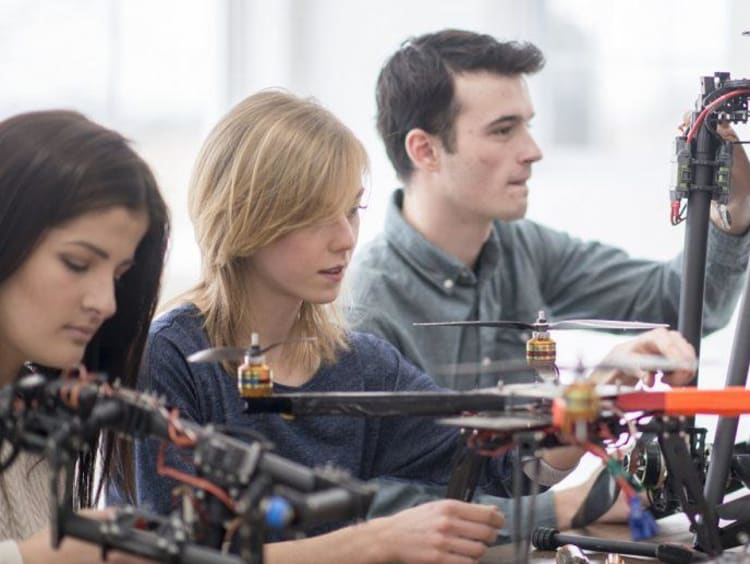 students working on robots