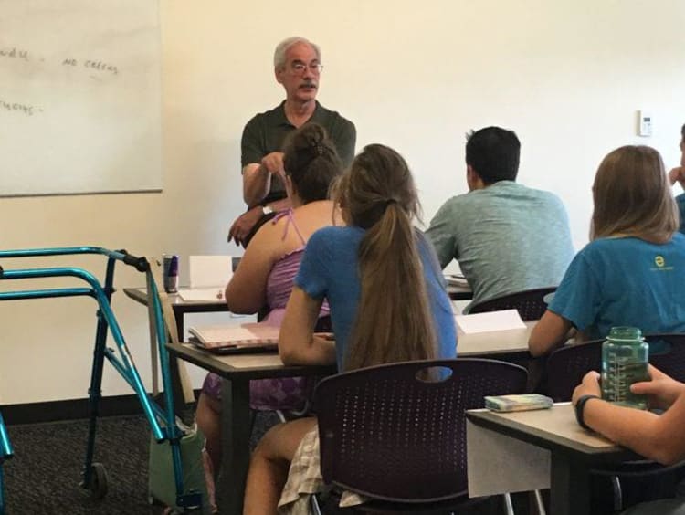 Dr. Val teaching a classroom full of students