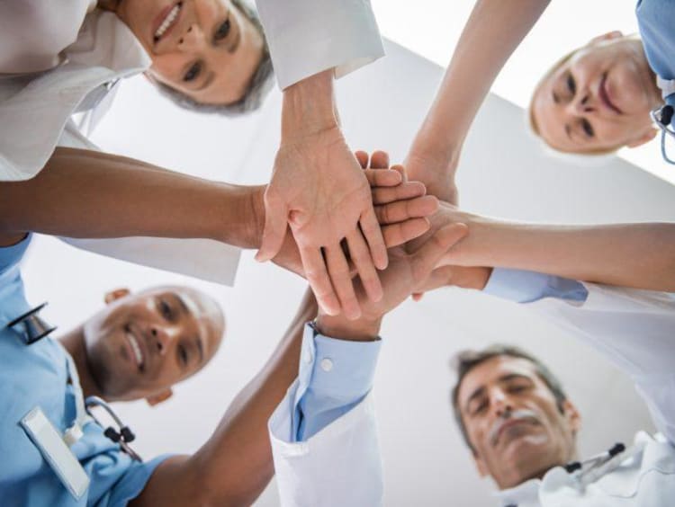 Team of nurses in a huddle