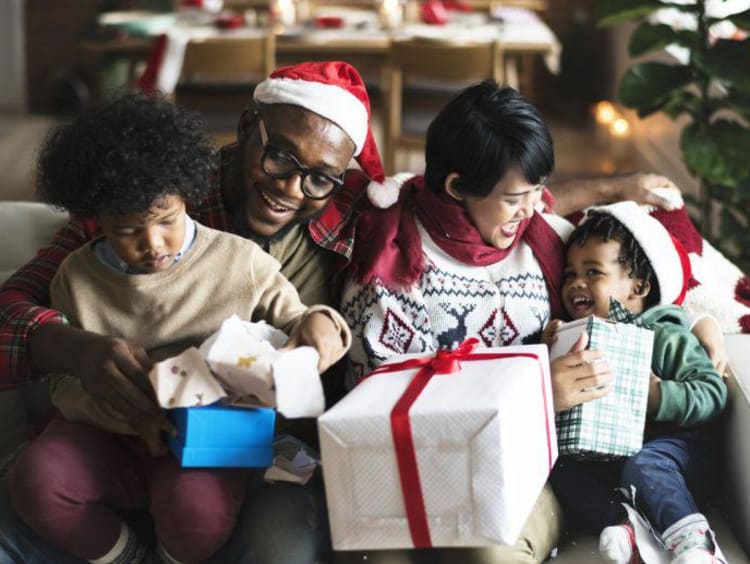 a family opening gifts on christmas