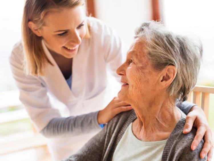 Health care administrator with elderly patient 