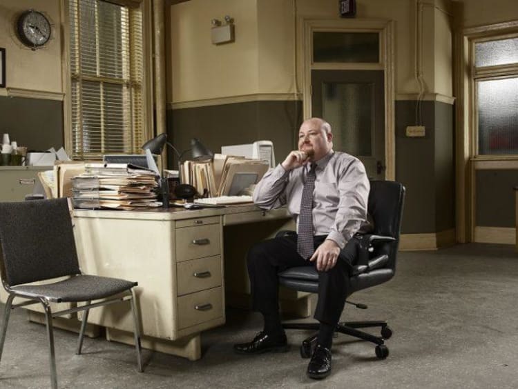 Victimologist working from a desk