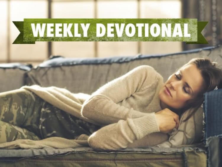 A student sleeping on the couch under a Weekly Devotional banner
