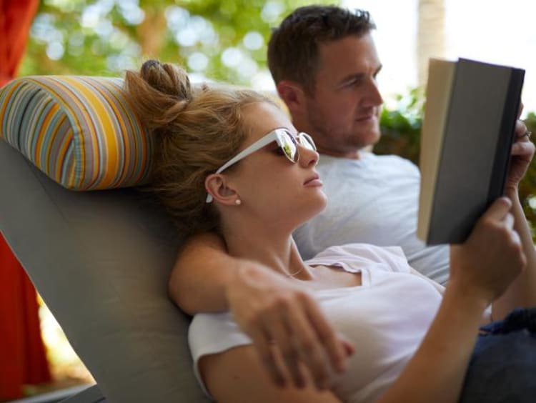 boyfriend and girlfriend reading a book