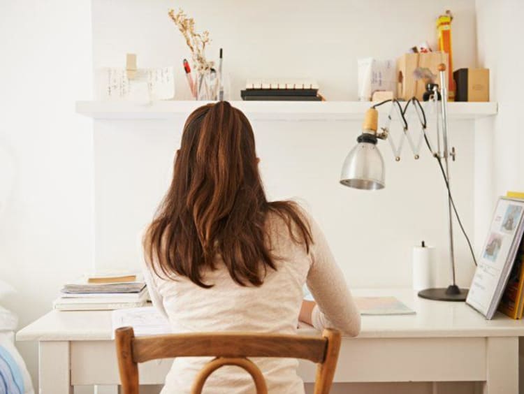 Woman invested in a project at her desk