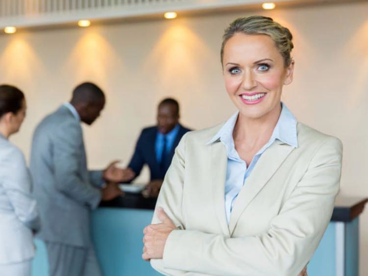 hospitality manager and receptionist with guests