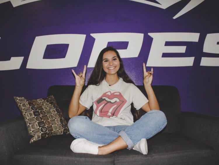 Tatum in front of a Lopes sign