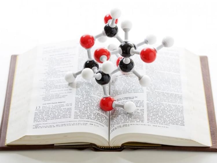 atoms on top of a bible