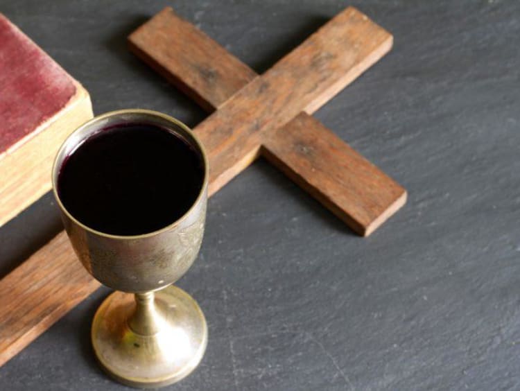 Wine and cross with bible