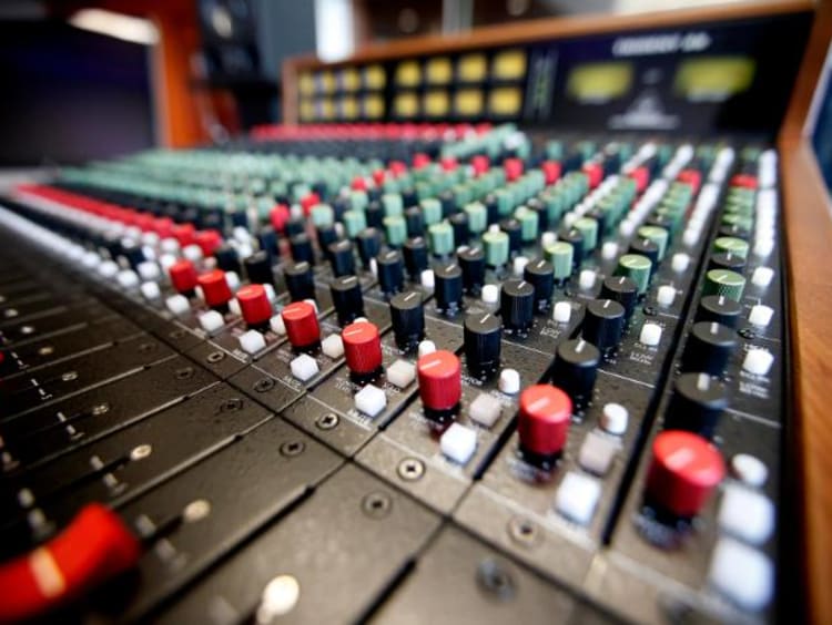 closeup of a recording studio sound board