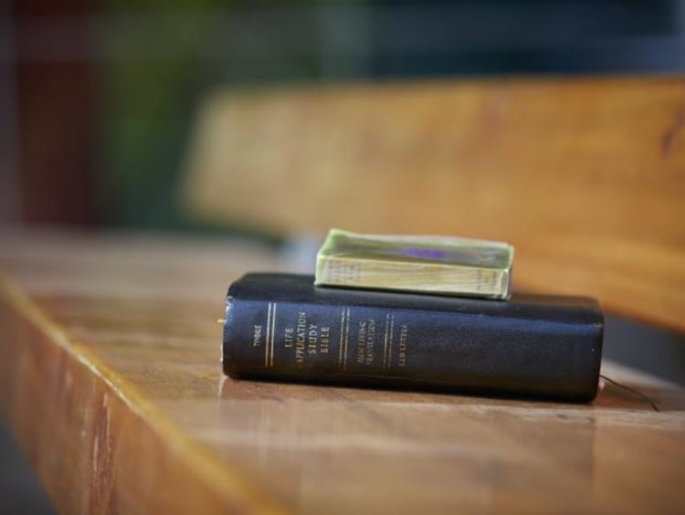 bible resting on a bench