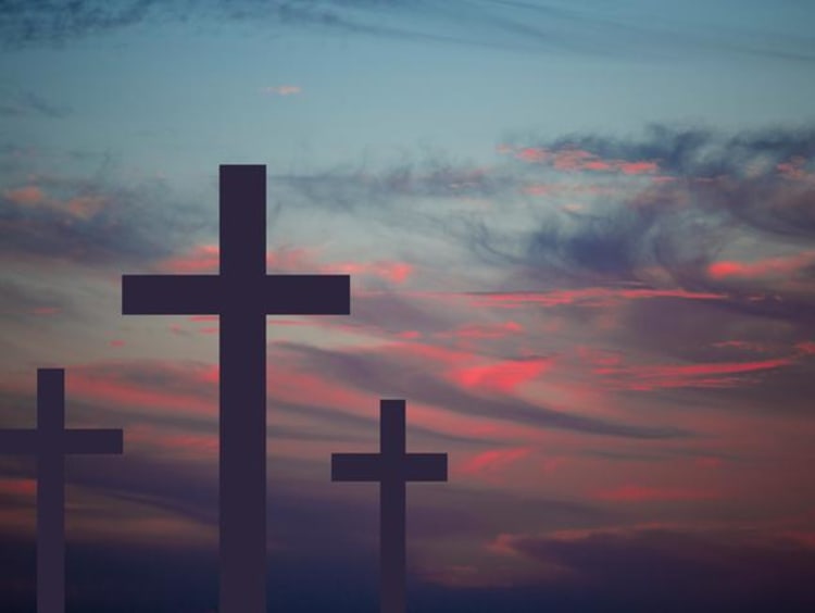 A hilltop of crosses at sunset