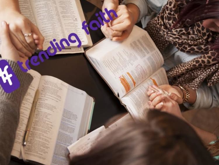 A group of people reading the Bible under the Trending Faith logo