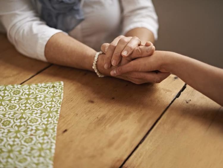 a hand holding another hand