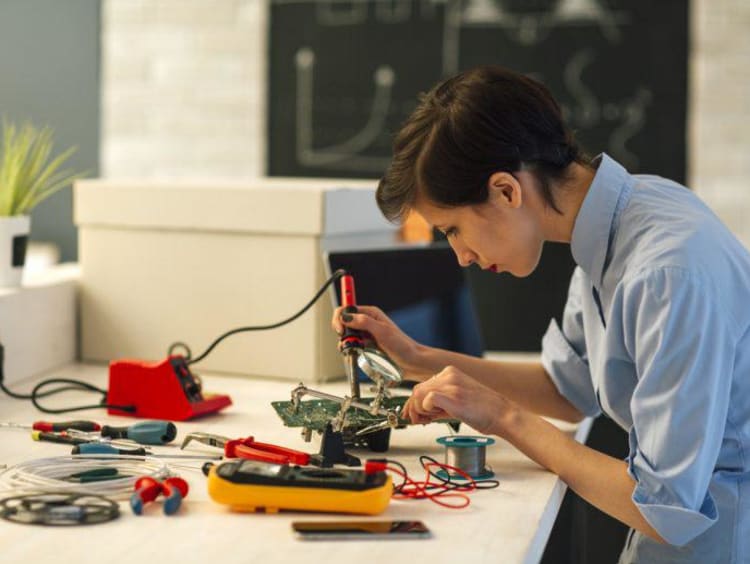 person working on electrical engineering