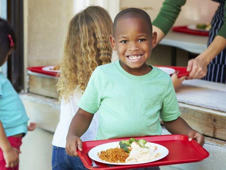 student eating a school lunch