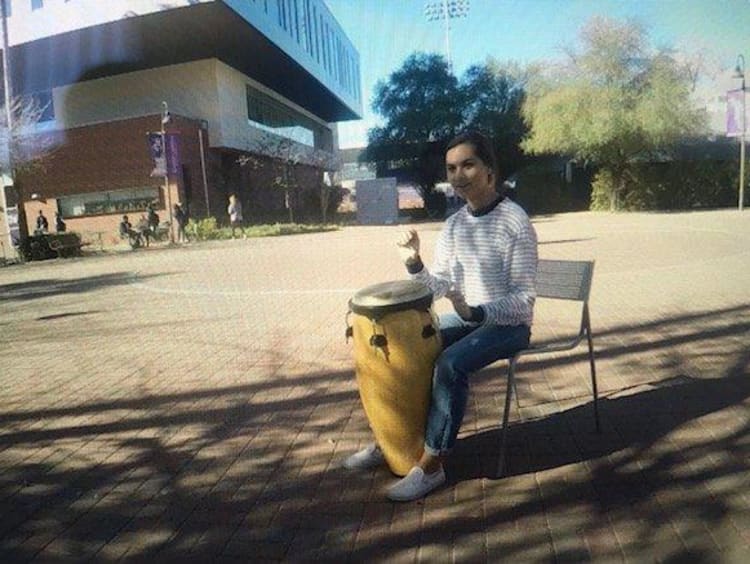 Tatum playing a drum at a campus club