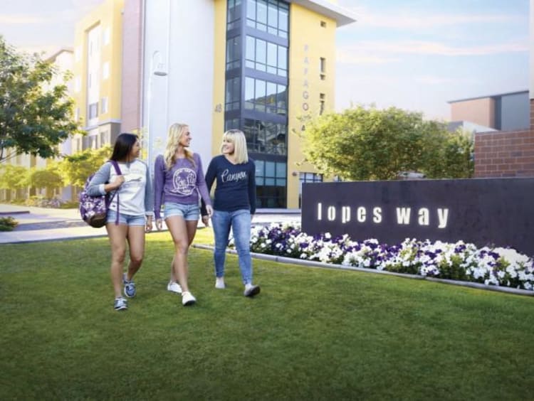 three GCU students walking on lopes way