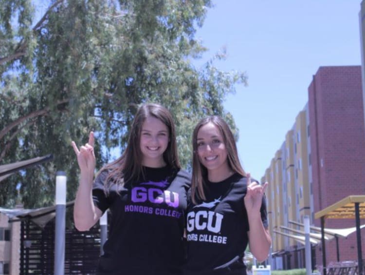 two girls holding a lopes up