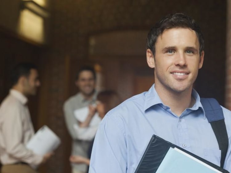 Business student carrying book