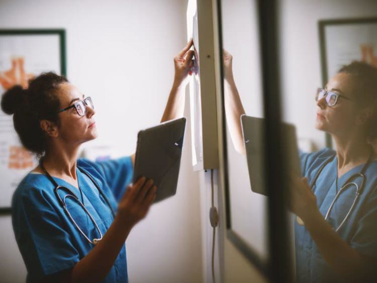 Nurse working with a tablet