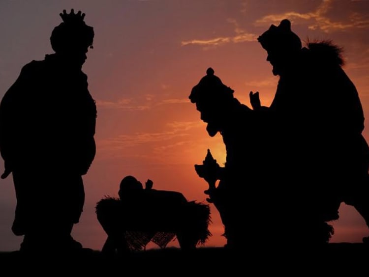 The three kings bringing gifts to baby Jesus