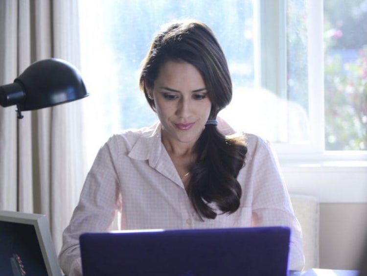 girl typing on computer