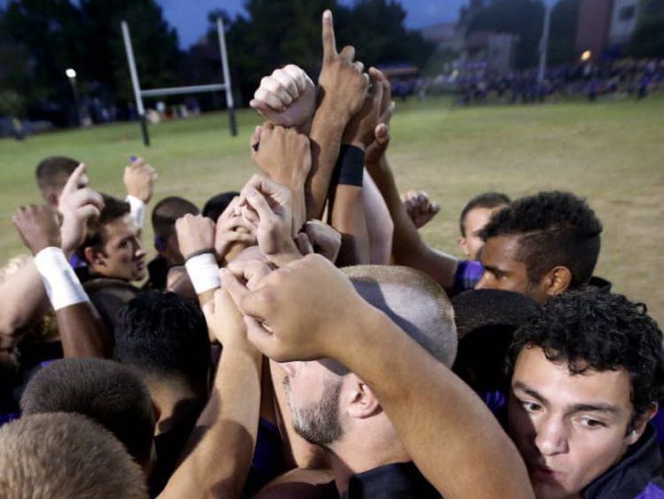 sports team in a huddle