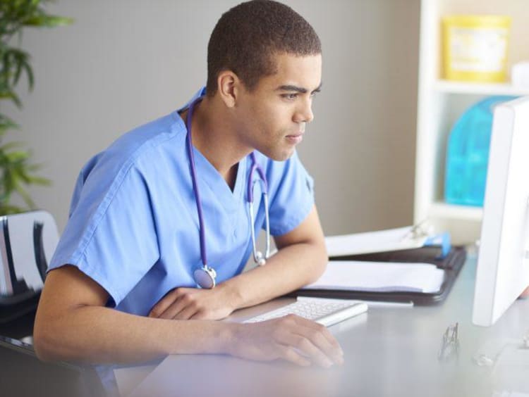 nurse working at a computer