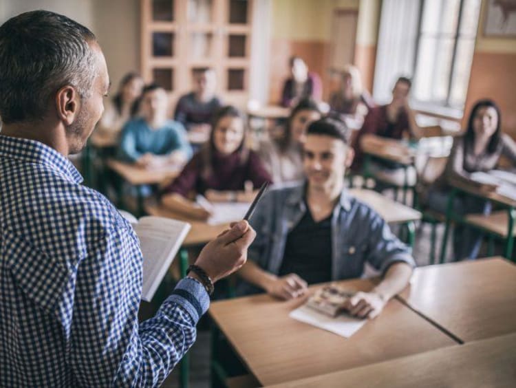 teacher in a classroom with students