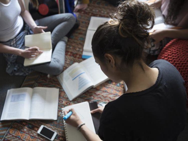 Woman studing with open books